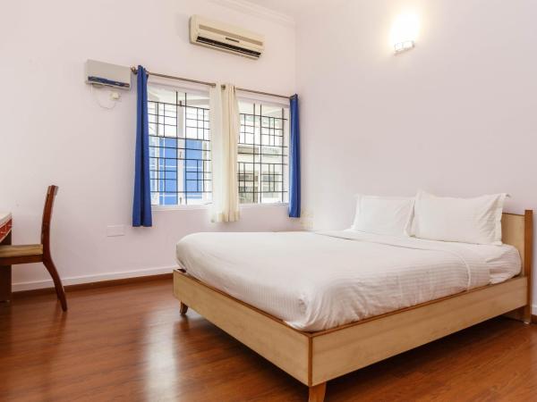 Locul Uptown - Near Bangalore Palace Grounds : photo 2 de la chambre chambre lit queen-size deluxe