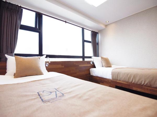 57 Myeongdong Hostel : photo 1 de la chambre chambre lits jumeaux deluxe
