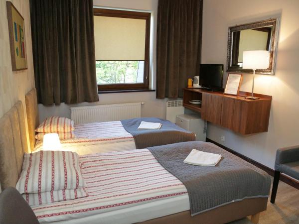 B & B Tomula : photo 1 de la chambre chambre lits jumeaux avec baignoire