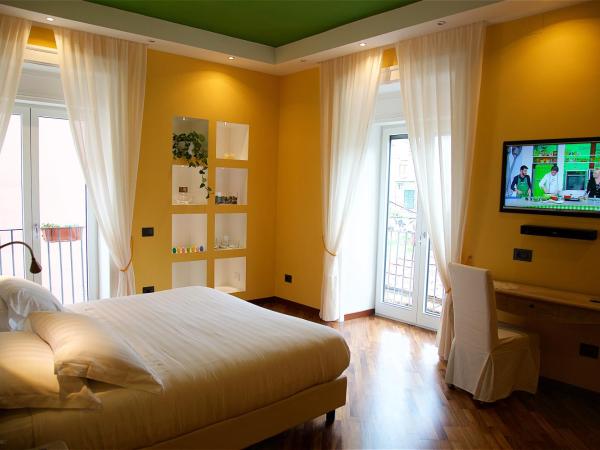 Il Giardino Segreto : photo 1 de la chambre chambre double ou lits jumeaux supérieure - vue sur jardin