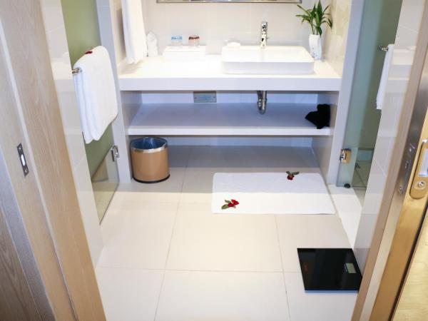 Sanya Phoenix Airport Hotel : photo 2 de la chambre chambre lit king-size supérieure