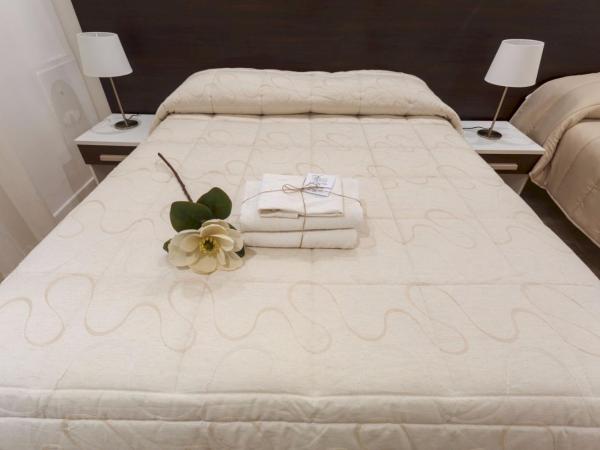 Due Passi Suite : photo 6 de la chambre chambre triple avec balcon