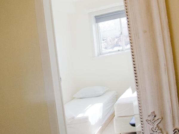 Igdlo Guesthouse : photo 1 de la chambre chambre lits jumeaux avec salle de bains commune