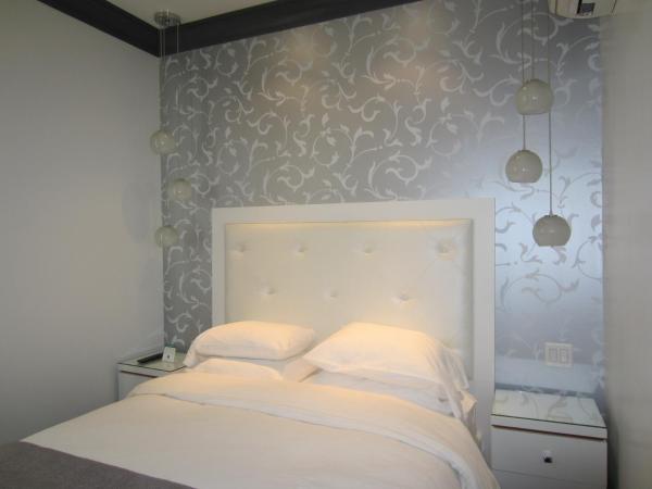 La Pensione Hotel : photo 1 de la chambre chambre lit queen-size - accessible aux personnes à mobilité réduite