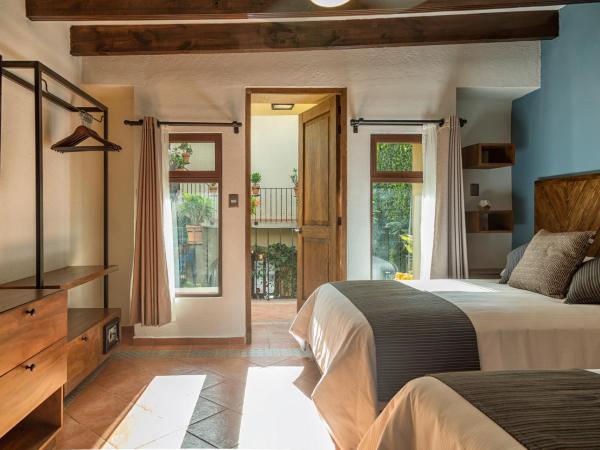 Morazul Hotel Boutique : photo 2 de la chambre chambre double avec 2 lits doubles