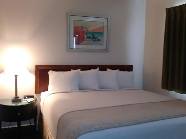 Beach Place Hotel : photo 7 de la chambre hébergement lit king-size supérieur avec kitchenette - parking gratuit