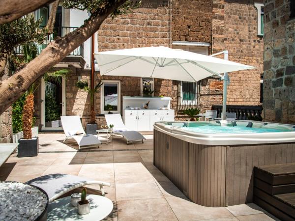 Antica Dimora Magi : photo 1 de la chambre suite de luxe avec baignoire spa