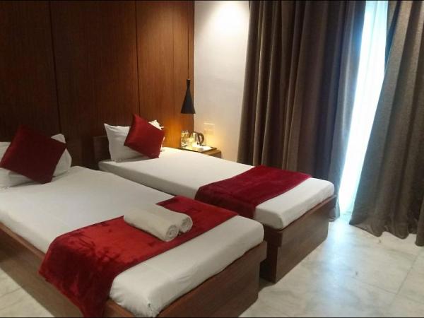 Tatvam Residency : photo 5 de la chambre chambre lits jumeaux deluxe