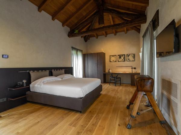 Relais San Vigilio al Castello : photo 3 de la chambre chambre double deluxe