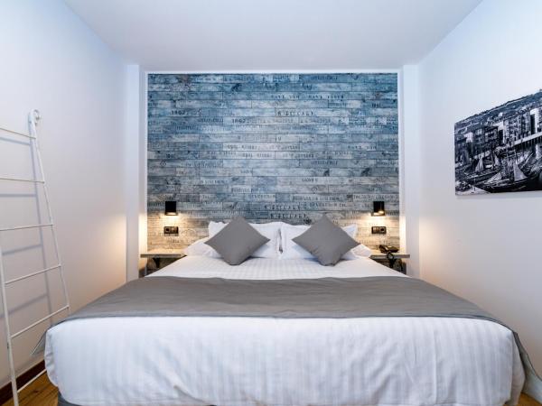 Suite Home Pinares : photo 6 de la chambre chambre double ou lits jumeaux