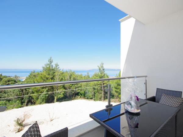 Villa Inis : photo 8 de la chambre suite lit queen-size – vue sur mer