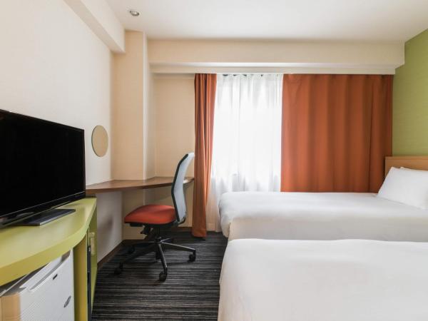 the b ikebukuro : photo 1 de la chambre chambre lits jumeaux supérieure avec douche - non-fumeurs