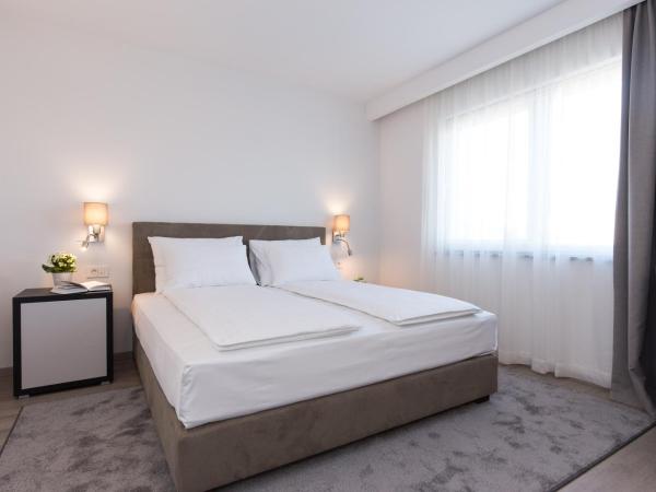 Pansion Leggero : photo 10 de la chambre chambre double de luxe avec balcon - vue sur ville