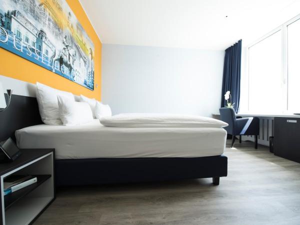 Carathotel Düsseldorf City : photo 7 de la chambre chambre double ou lits jumeaux supérieure