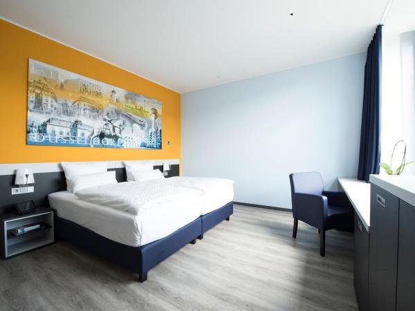 Carathotel Düsseldorf City : photo 2 de la chambre chambre double ou lits jumeaux supérieure
