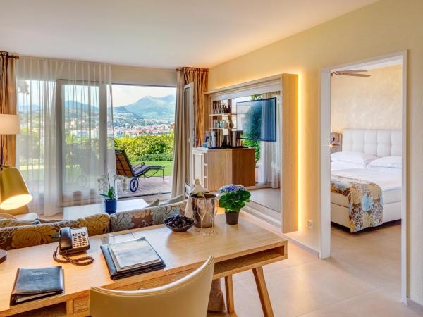 Suitenhotel Parco Paradiso : photo 7 de la chambre suite avec accès au jardin