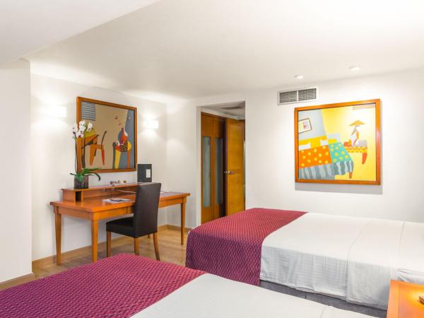 Eurostars Zona Rosa Suites : photo 5 de la chambre chambre triple