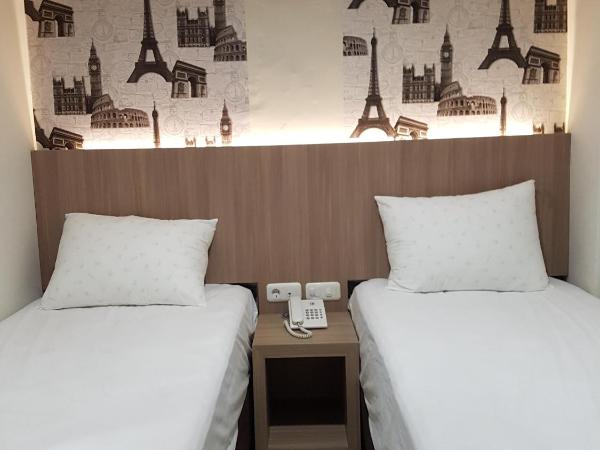 Ethan Hotel Kelapa Gading : photo 4 de la chambre chambre lits jumeaux deluxe