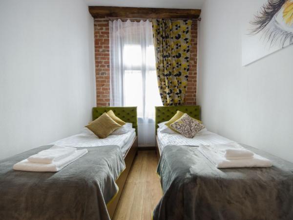 Apartamenty Mieszczańskie u Gołębiewskich : photo 9 de la chambre chambre lits jumeaux spacieuse