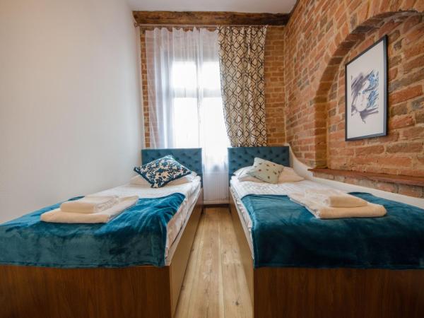 Apartamenty Mieszczańskie u Gołębiewskich : photo 6 de la chambre chambre lits jumeaux spacieuse