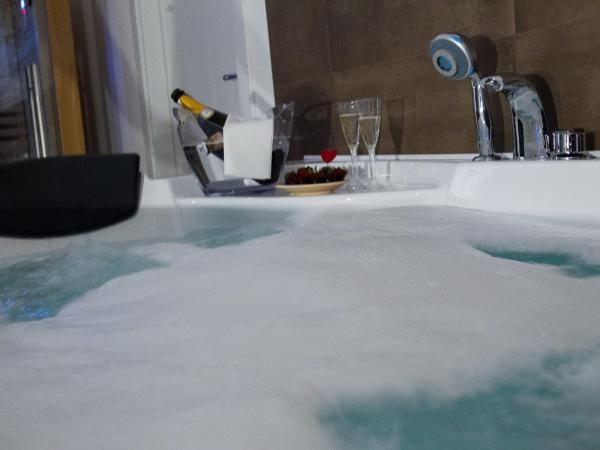 Palermo Gallery : photo 4 de la chambre chambre lit king-size avec baignoire spa