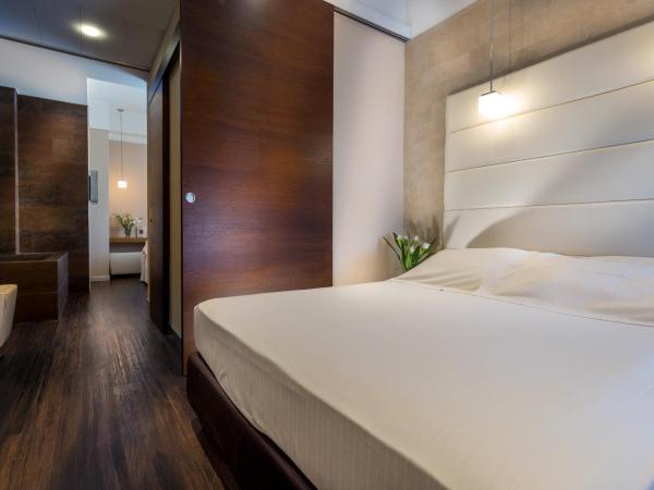 Bio Boutique Hotel XU' - Gruppo Ambienthotels : photo 9 de la chambre chambre deluxe avec 2 lits queen-size