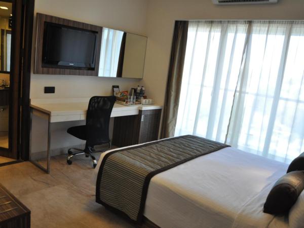Residency Sarovar Portico : photo 8 de la chambre chambre deluxe double ou lits jumeaux