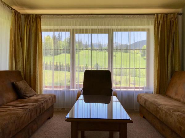 Willa Wisienka : photo 4 de la chambre cette chambre double de luxe comprend 1 chambre et un salon