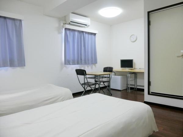 Hotel Chuo Oasis : photo 2 de la chambre chambre lits jumeaux