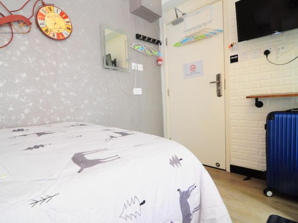 Big Wave Travel : photo 2 de la chambre chambre quadruple avec vue sur la ville