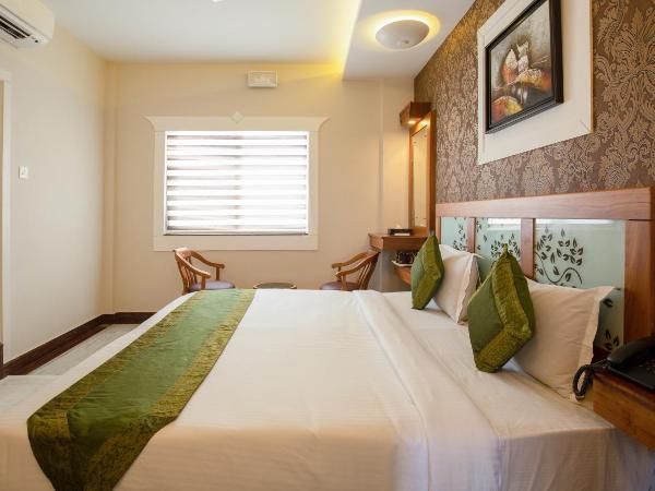 Treebo The Qasr : photo 6 de la chambre [sanitized] standard double room