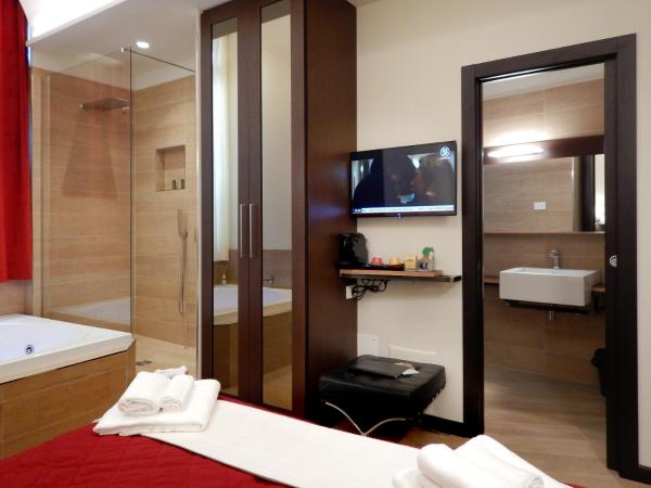 Arena Luxury Suite : photo 7 de la chambre chambre double ou lits jumeaux supérieure - vue sur jardin