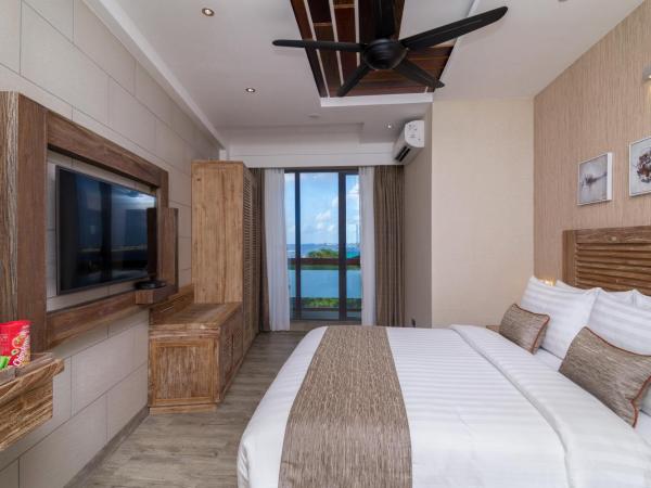 Samann Grand : photo 4 de la chambre hébergement double super deluxe avec balcon - vue sur océan (navette aéroport aller-retour gratuite)