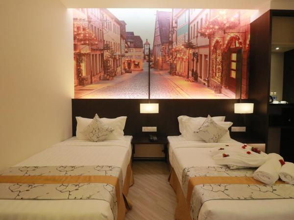 Amamas Boutique Hotel Kuching : photo 4 de la chambre chambre lits jumeaux sans fenêtre