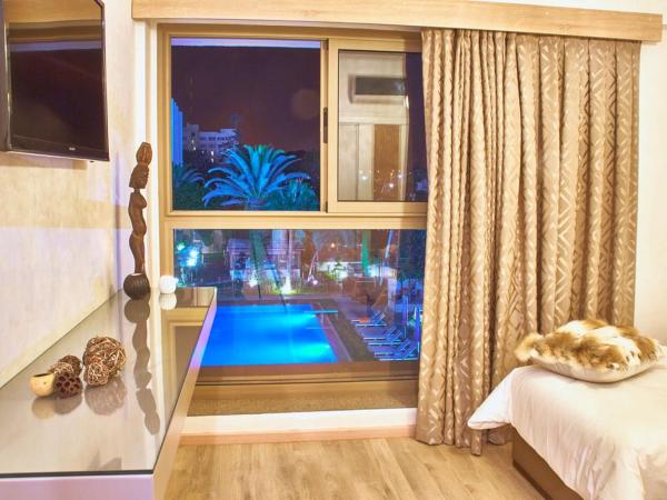 Mabrouk Hotel and Suites- Adult only : photo 8 de la chambre chambre double - vue sur piscine