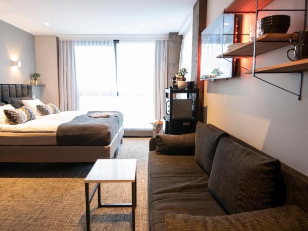 B14 Apartments & Rooms : photo 4 de la chambre chambre triple avec salle de bains privative