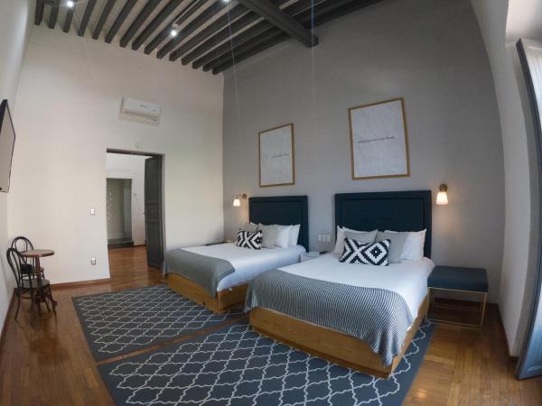 Markee Hotel Boutique : photo 1 de la chambre suite junior avec 2 lits doubles