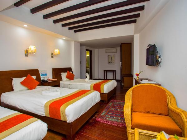 Apsara Boutique Hotel : photo 10 de la chambre chambre triple deluxe avec vue sur jardin