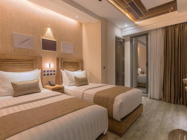 Samann Grand : photo 4 de la chambre hébergement double ou lits jumeaux deluxe avec balcon - vue sur océan (navette aéroport aller-retour gratuite)