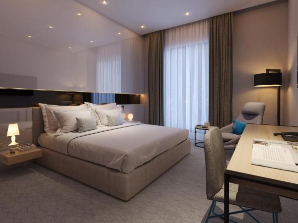 Studio M Arabian Plaza Hotel & Hotel Apartments : photo 3 de la chambre appartement 3 chambres urbain - service de navette gratuit vers plage d'al mamzar et centre-ville de deira