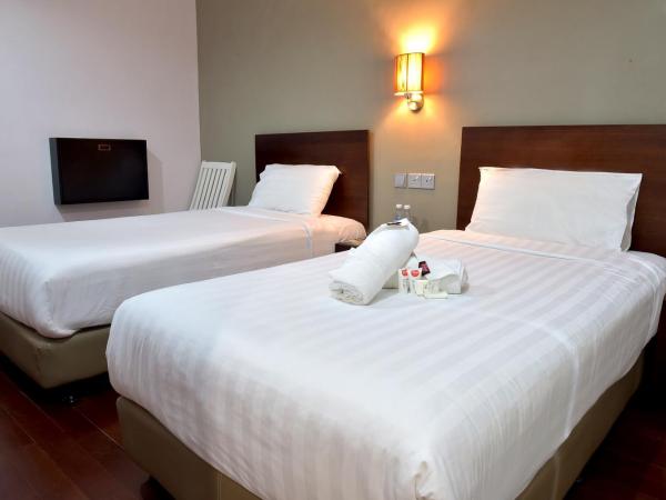 Tune Hotel - Waterfront Kuching : photo 1 de la chambre chambre lits jumeaux sans fenêtre