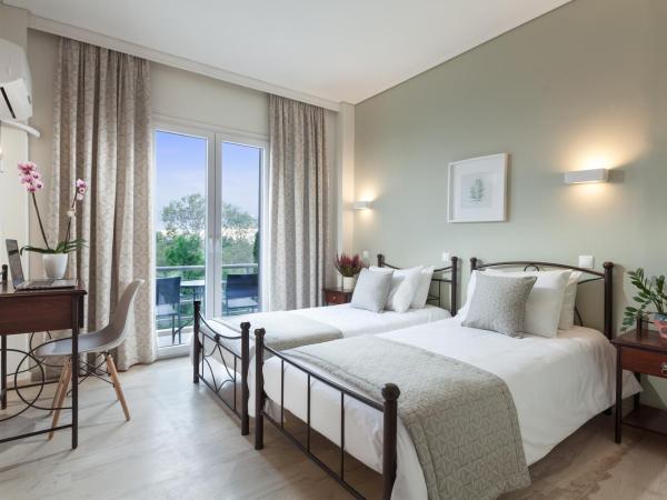 Minavra Hotel : photo 2 de la chambre chambre quadruple supérieure - vue sur mer