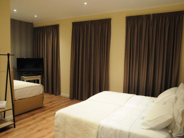 Naya-Downtown Guesthouse : photo 5 de la chambre chambre quadruple avec balcon