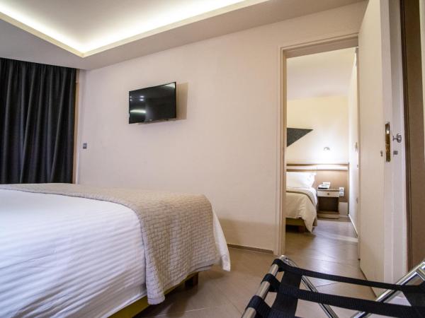 Emmantina Hotel : photo 5 de la chambre chambres doubles ou lits jumeaux communicantes - vue latérale sur mer