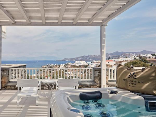 Myconian Kyma, a Member of Design Hotels : photo 1 de la chambre suite junior avec jacuzzi extérieur - vue sur mer couché de soleil