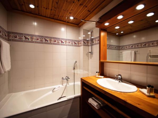 La Savoyarde : photo 6 de la chambre chambre double ou lits jumeaux avec baignoire - sud