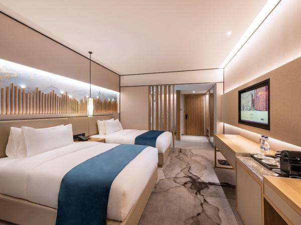 Mercure Chengdu Huapaifang : photo 1 de la chambre chambre lits jumeaux supérieure