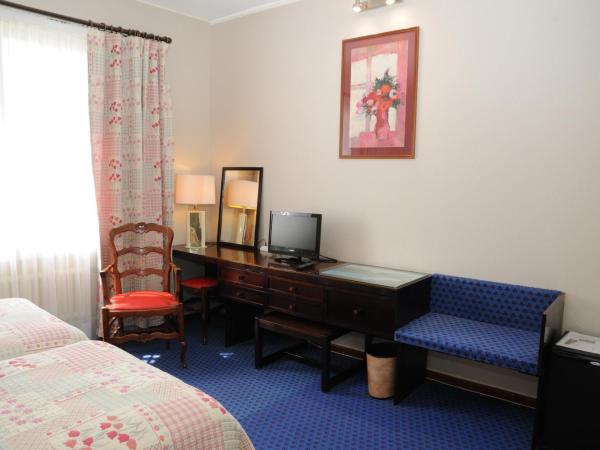 Grand Hôtel du Cours : photo 6 de la chambre chambre lits jumeaux avec baignoire