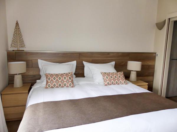 Les Ambaciales : photo 3 de la chambre chambre double ou lits jumeaux avec lit d'appoint