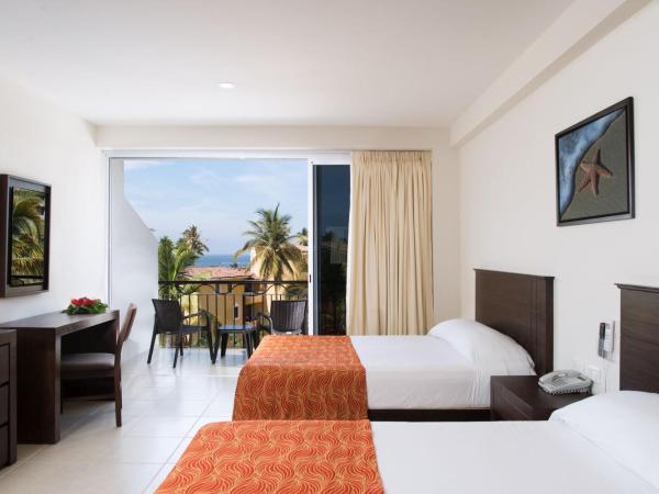 Costa Club Punta Arena - Todo Incluido : photo 1 de la chambre chambre deluxe avec 2 lits doubles